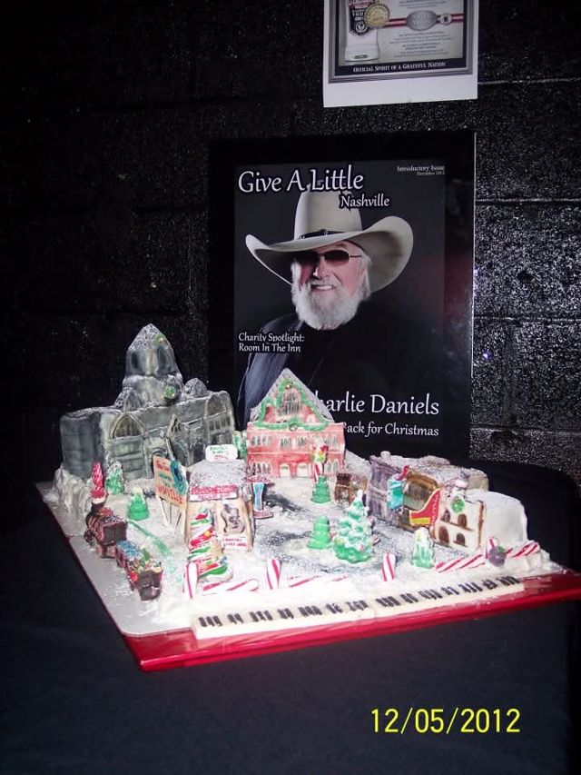 The introductory issue on display beside a gingerbread Nashville skyline